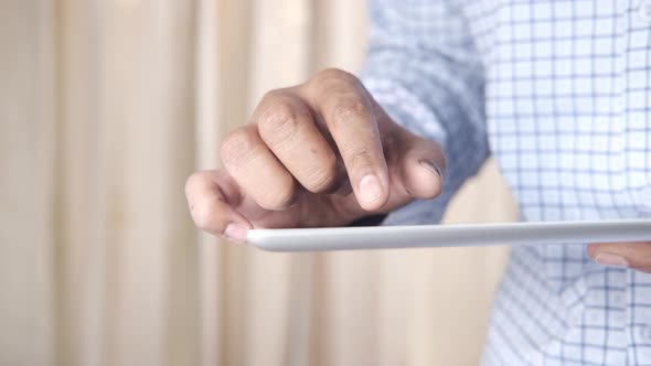 Businessman Using Digital Tablet on Office Desk