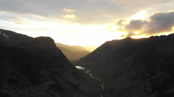 Aerial drone view of highlands in Scotland at sunset