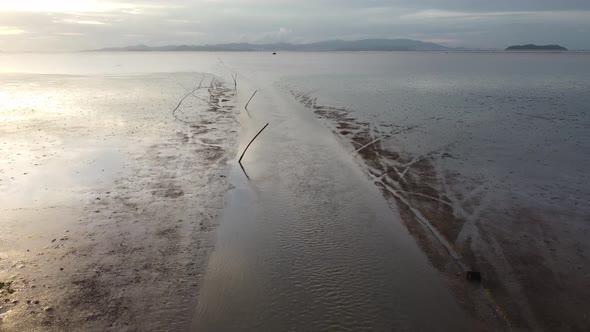 Fly over boat path muddy at mangrove sea coastal