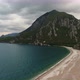 Aerial View of Beach, Sea and Mountain on a Cloudy Day - VideoHive Item for Sale