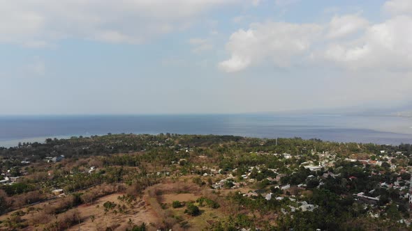 Drone shot of Gili Air island, Indonesia, on a hot, sunny day.