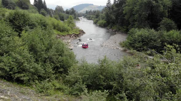 People Kayaking on Rapid River Stream