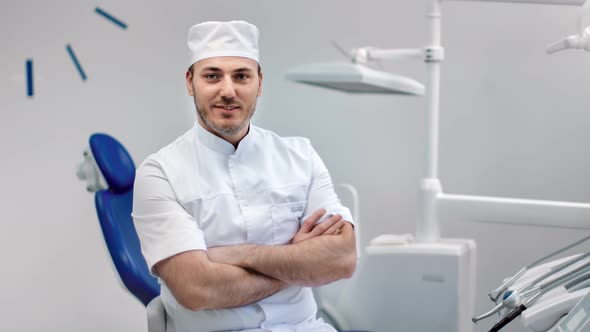 Portrait of Smiling Dentist Doctor in Uniform Posing at Stomatology