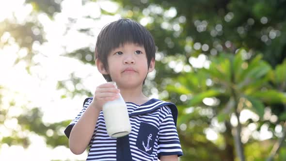 Asian Child Is Showing Dislike Drinking Milk Expression