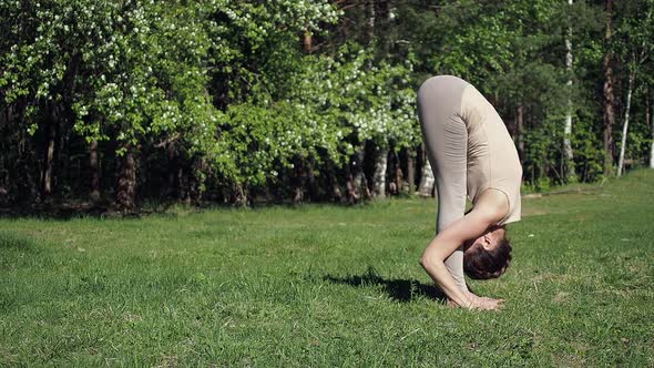Woman Doing Yoga in Park