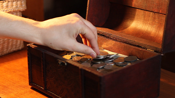 Woman Puts Silver Coin to Chest