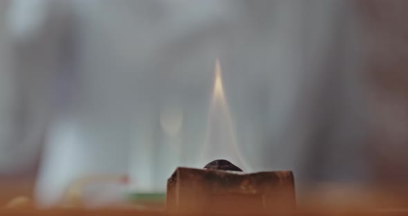 Woman Scientist Studying Chemical Liquid in Lab Glassware
