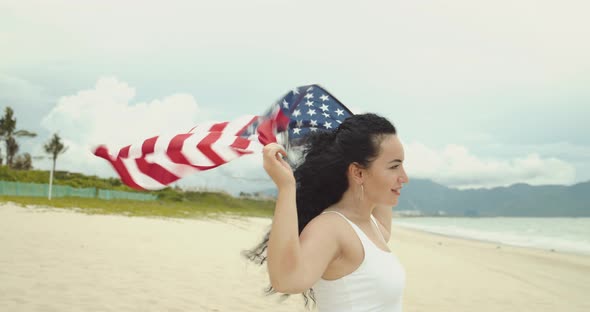 Patriotism Independence Day and Holidays Concept Happy Smiling Young Woman in Swimsuit with National