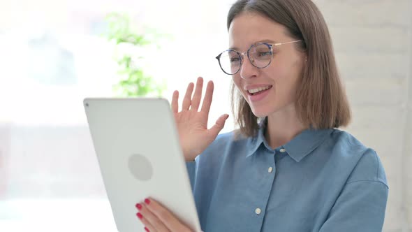 Video Call on Tablet by Young Woman