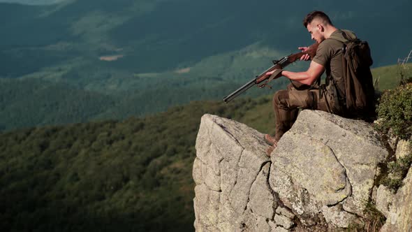 Hunter Man. Hunting Period, Autumn Season. Guy with Gun. A Hunter with a Hunting Gun and Hunting