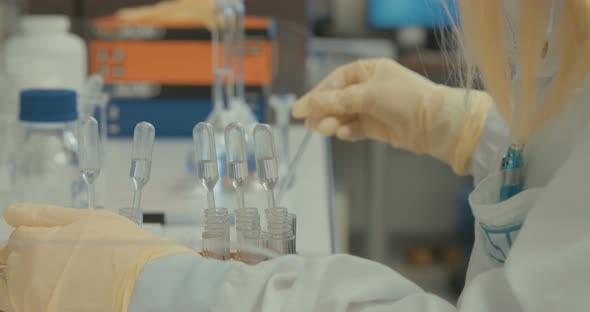 Scientist working in a pharmaceutical laboratory conducting experiments