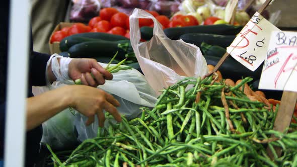 People buying fresh produce at an open market in San Francisco