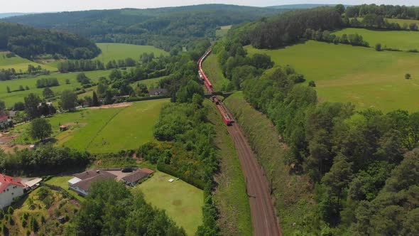 freight train working its way through countryside