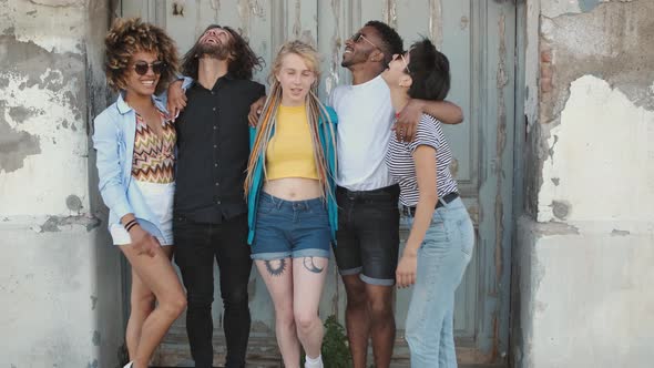 Young Happy Friends Posing on Street