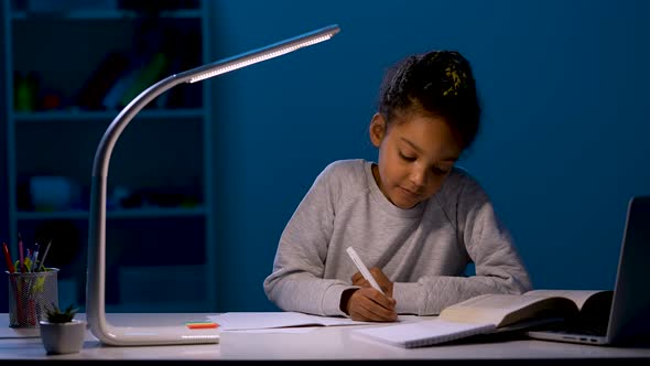 The Girl Rewrites the Task From the Textbook Into a Notebook