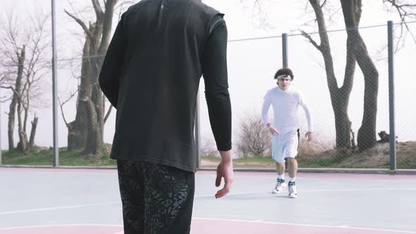 Two Basketball Player Playing Basketball Outdoors Slow Motion