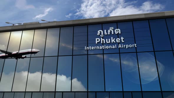 Airplane landing at Phuket Thailand airport mirrored in terminal