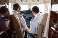 Pilot And Copilot In Cockpit Of Corporate Jet - PhotoDune Item for Sale