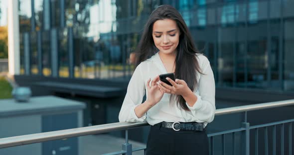 Beautiful Smiling Woman Working in Company Comes Out for Break Dressed in Elegant Outfit Stands