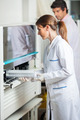 Researcher Loading Samples In Analyzer - PhotoDune Item for Sale