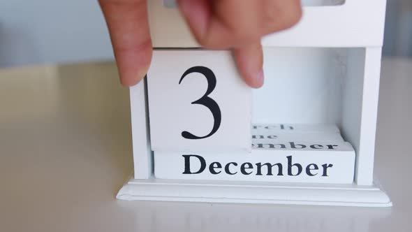 Change the Date on the Wooden Calendar on 31 December Happy New Year
