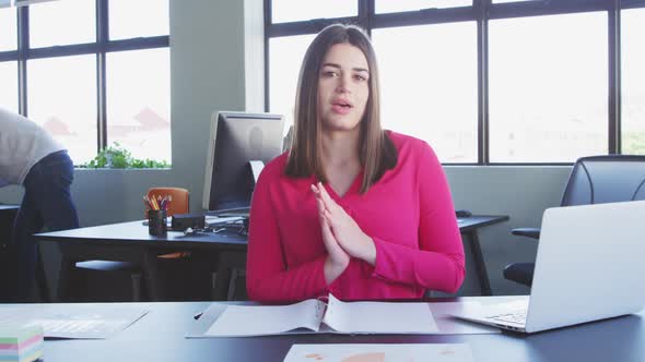 Businesswoman interviewing someone in modern office