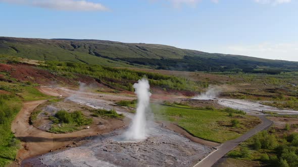 Rare double eruption of Strokkur geyser, Iceland (aerial view)