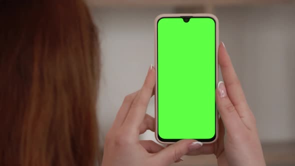 Handheld Camera: Point of View of woman Using Phone With Green Mock-up Screen Chroma Key Surfing Int