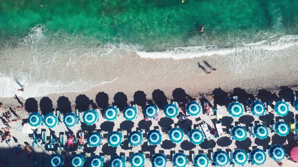 Aerial Overhead View of Lined Beach Umbrellas on a Tropical Beach