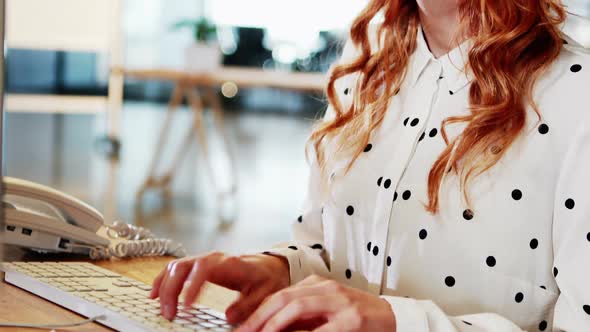 Businesswoman working on computer