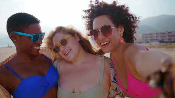 young women having fun on the beach