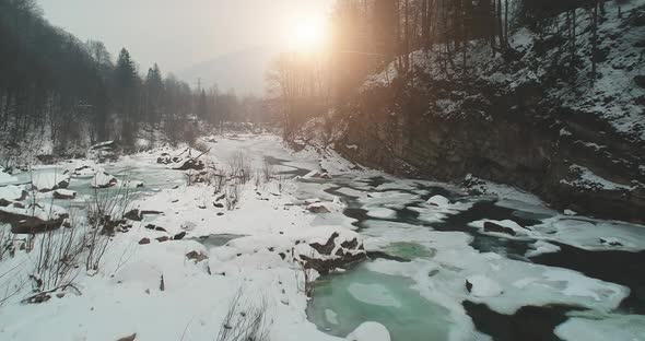 Slow Motion of Sun Ice Covered River Aerial