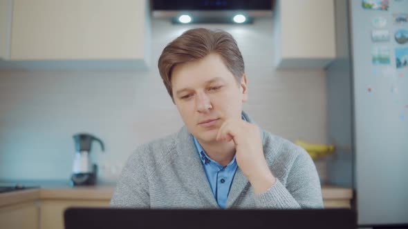 Man Thinking While Sitting at the Computer