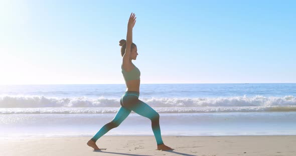 Woman Performing Yoga in The Beach