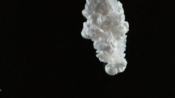 Slow motion shot of white ink on black background, shot with Phantom Flex 4K camera. alt