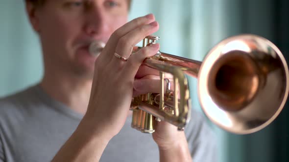 A Young Man Plays the Trumpet