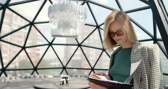 Business European Woman Holding Documents in Hands