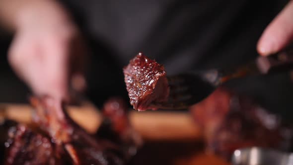 juicy piece of beef ready-made steak on a fork