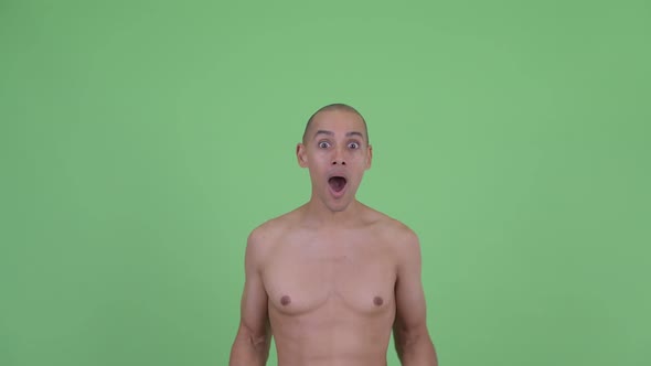 Face of Happy Bald Multi Ethnic Shirtless Man Looking Surprised