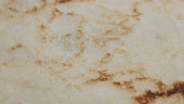 Texture of pancake after being fried  close-up 4K 2160p 30fps UltraHD tilting  footage - Slow tilt o