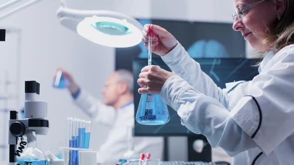 Low Angle Handheld Shot of Female Researcher alt