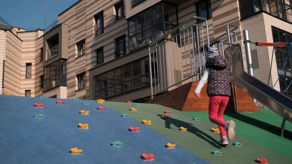 Adorable Little Girl Having Fun on Playground