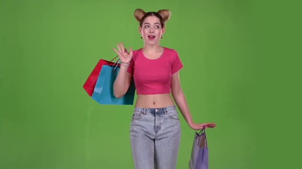 Girl Goes Shopping with Bags in His Hands. Green Screen