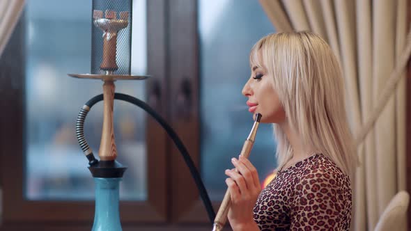 Fashionable Blonde Woman Smoking Hookah Blow Smoke