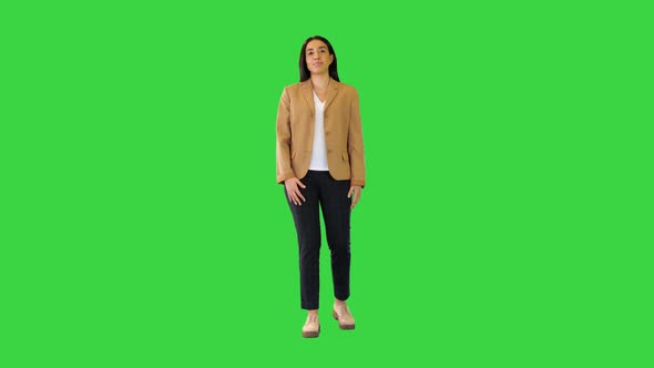 Indian Girl Telling Something Counting on Fingers on a Green Screen Chroma Key