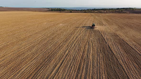 Tractor plowing field