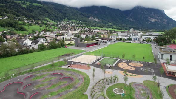 Playground for Children in Liechtenstein Among the Mountain Valley Aerial Vew