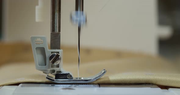 Dressmaker Working on Sewing Machine Closeup