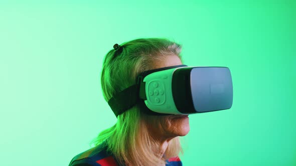 Senior Woman Enjoying VR Indoors