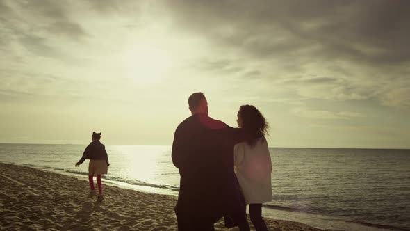 Relaxed Family Walking Sand Beach at Sunset Sky Nature